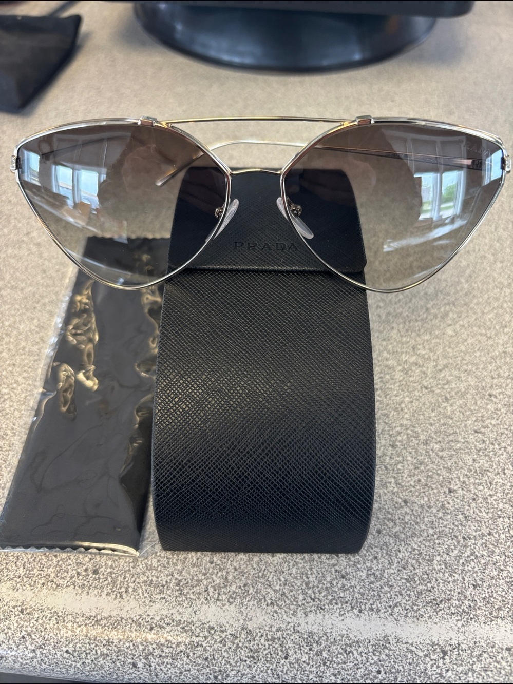 Prada Light Gold Cat-Eye Sunglasses with Gradient Brown Lenses